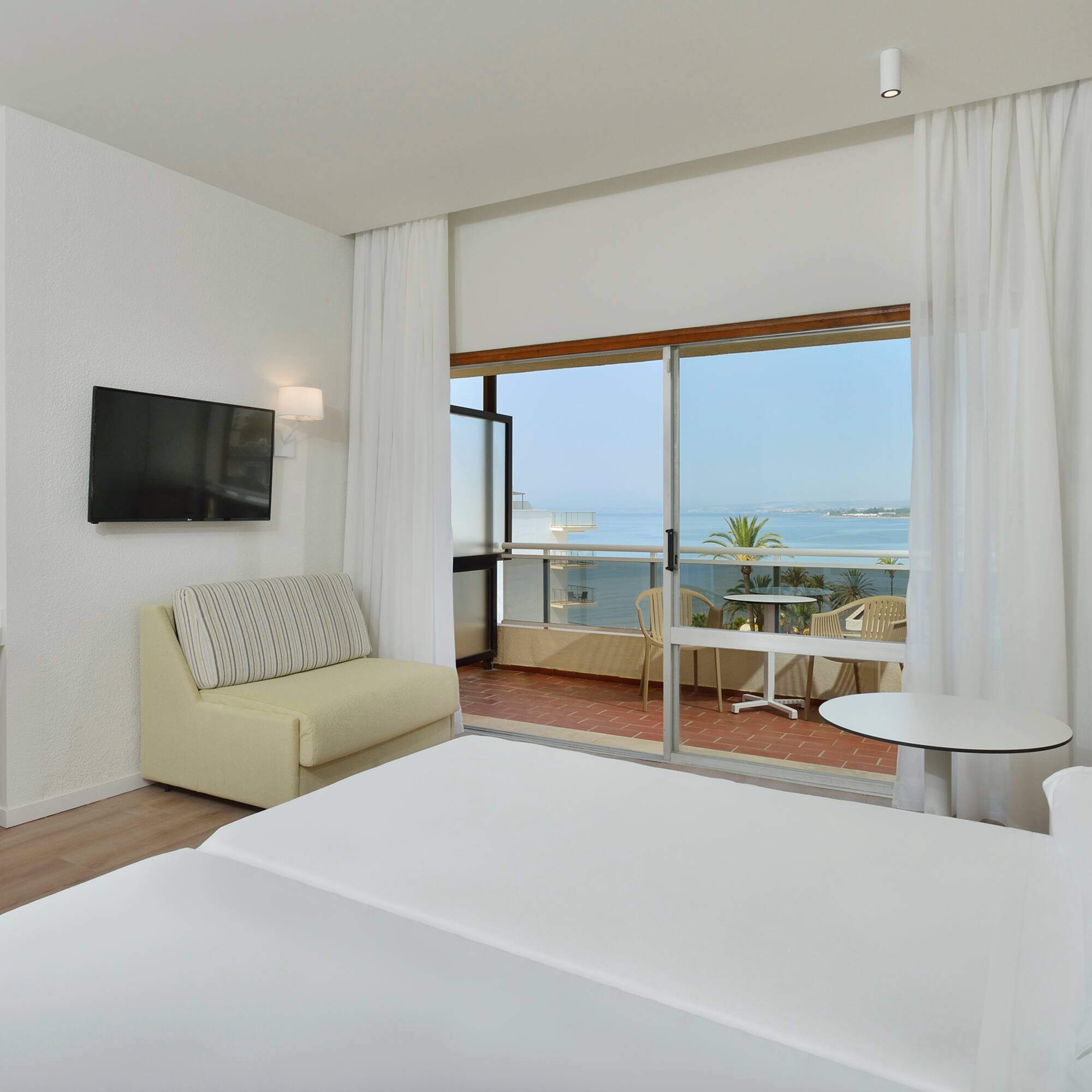 a room with a television and a bed