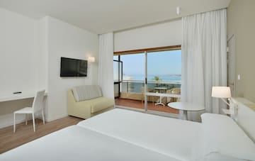 a room with a television and a bed