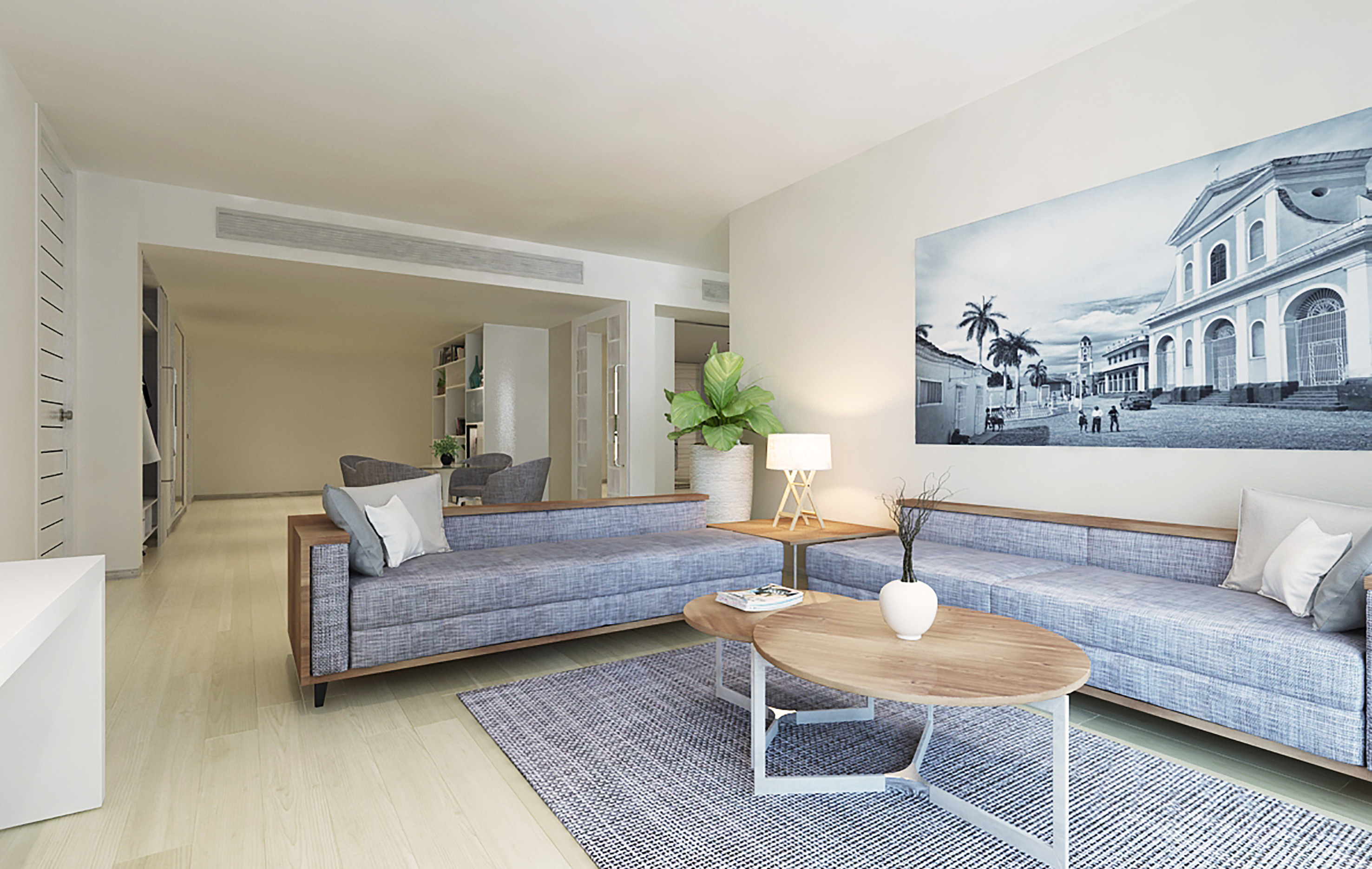 a living room with couches and a table