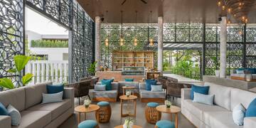 a room with a couch and tables