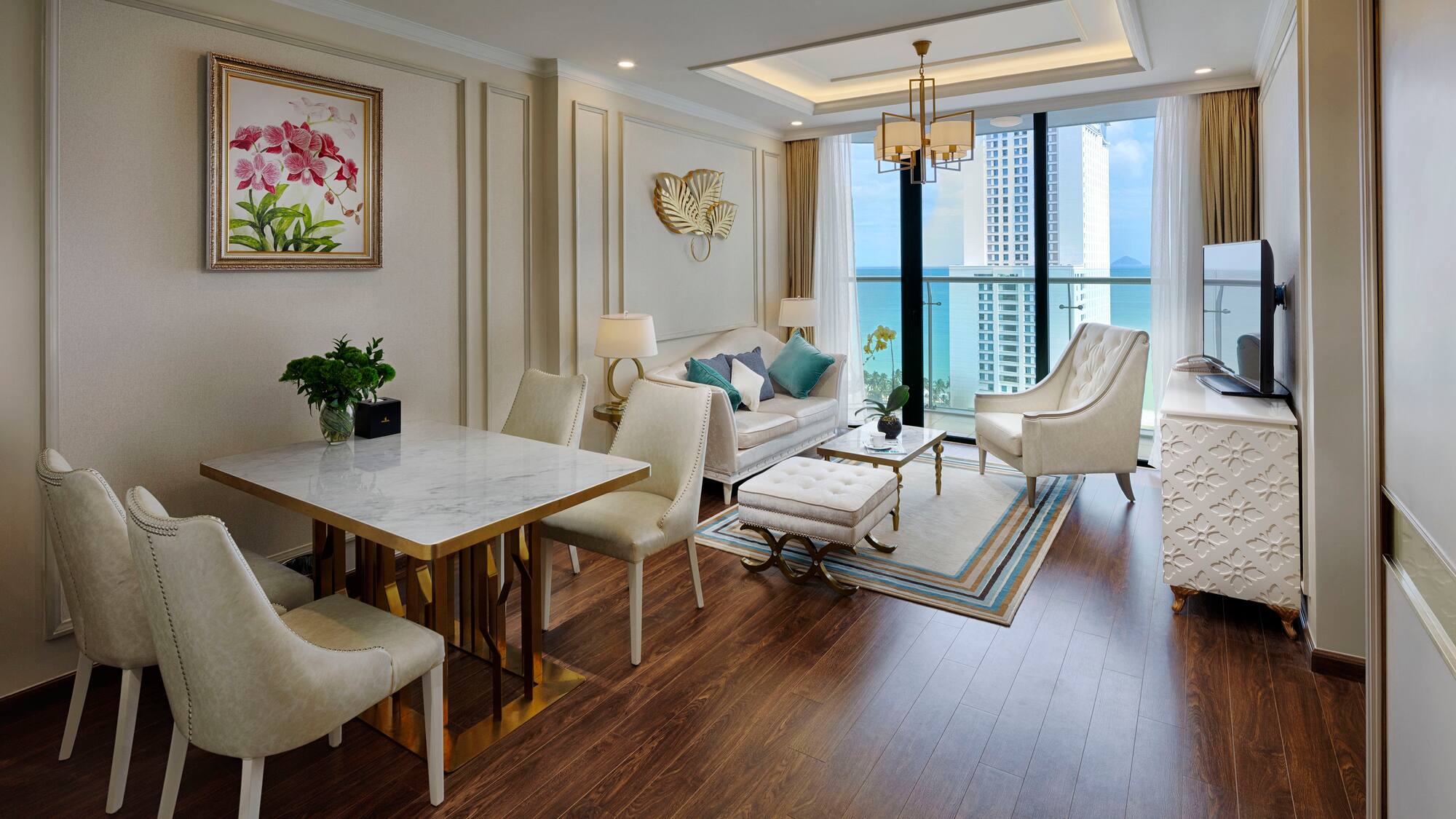 a living room with a table and chairs