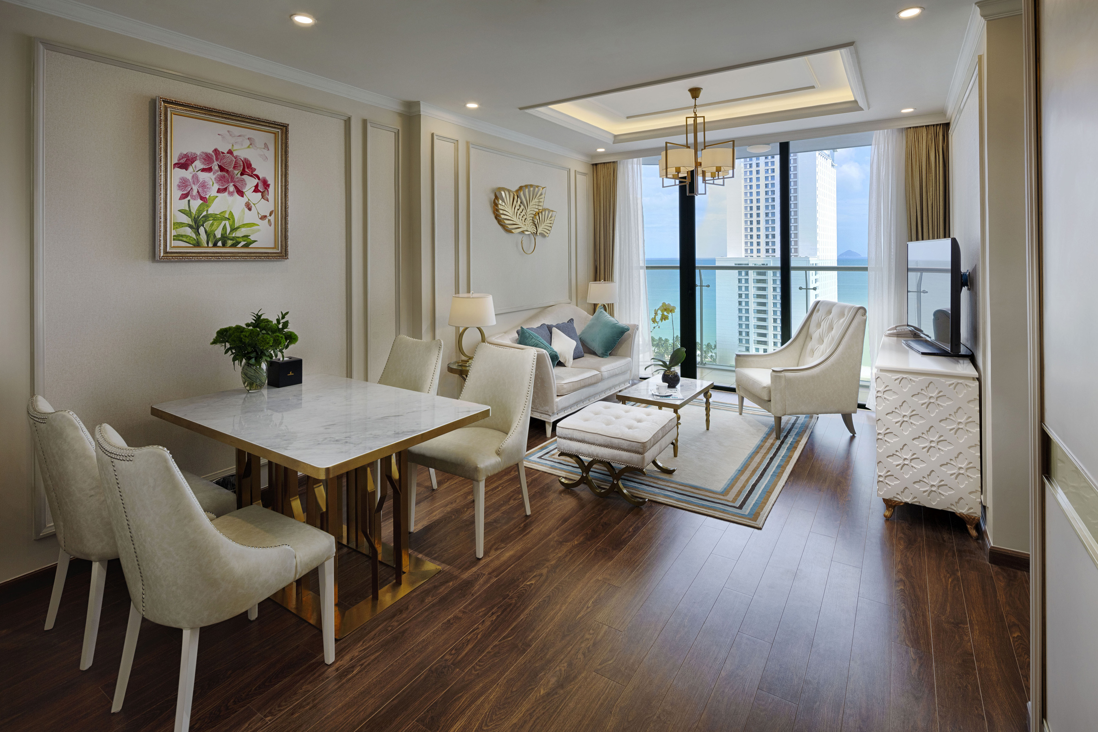 a living room with a table and chairs