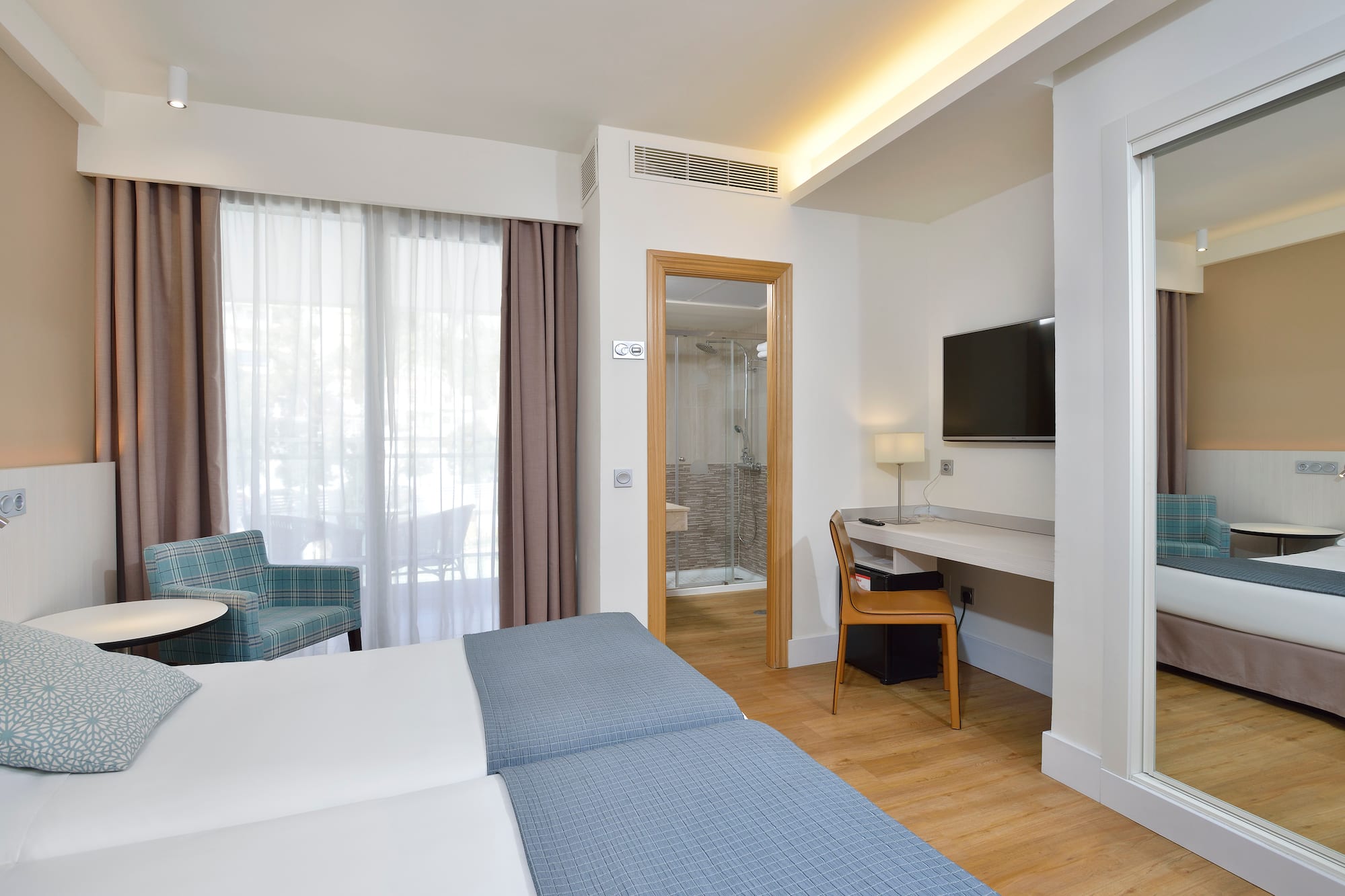 a room with a bed and a chair