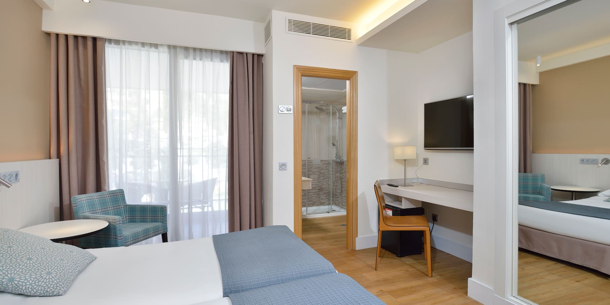 a room with a bed and a chair