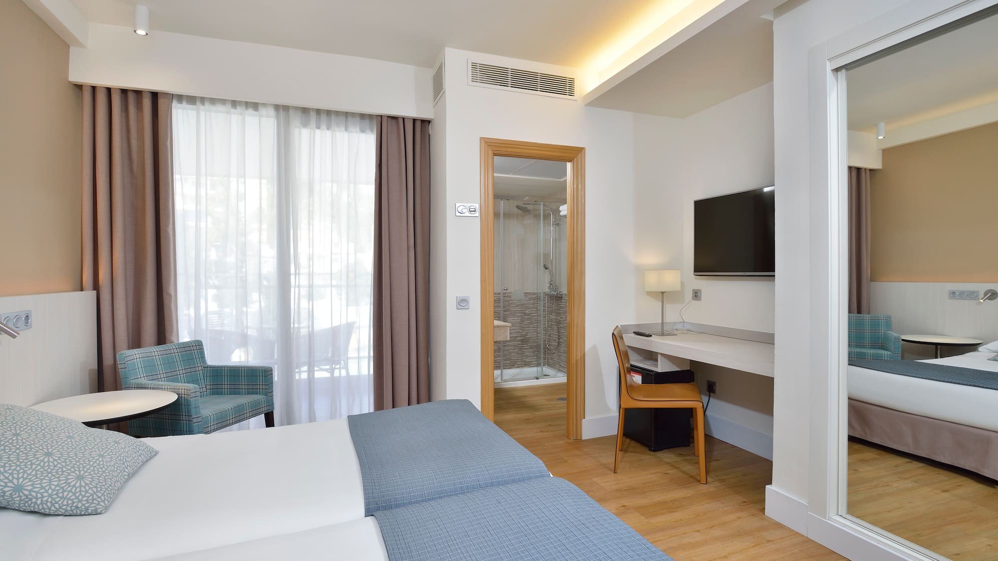 a room with a bed and a chair