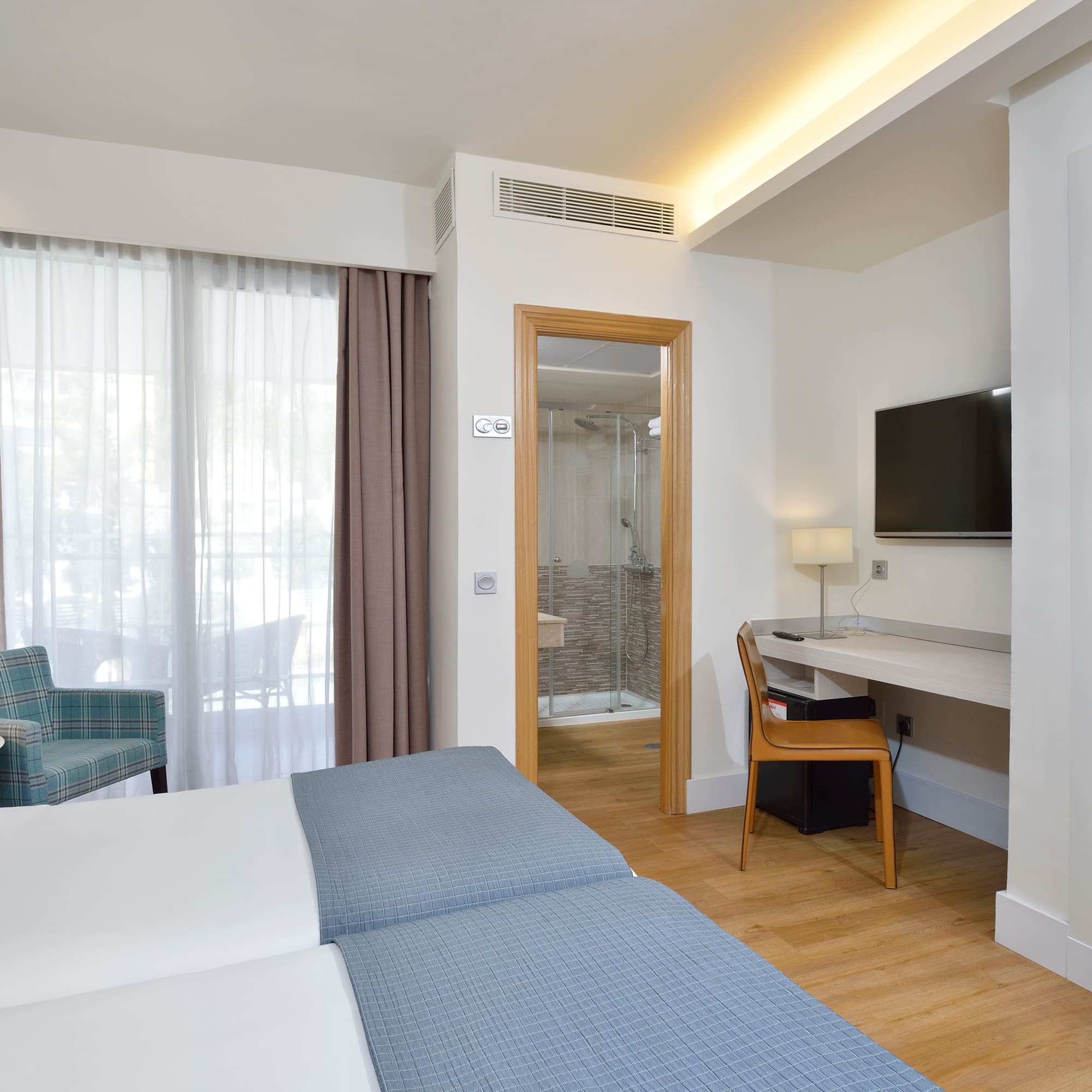 a room with a bed and a chair