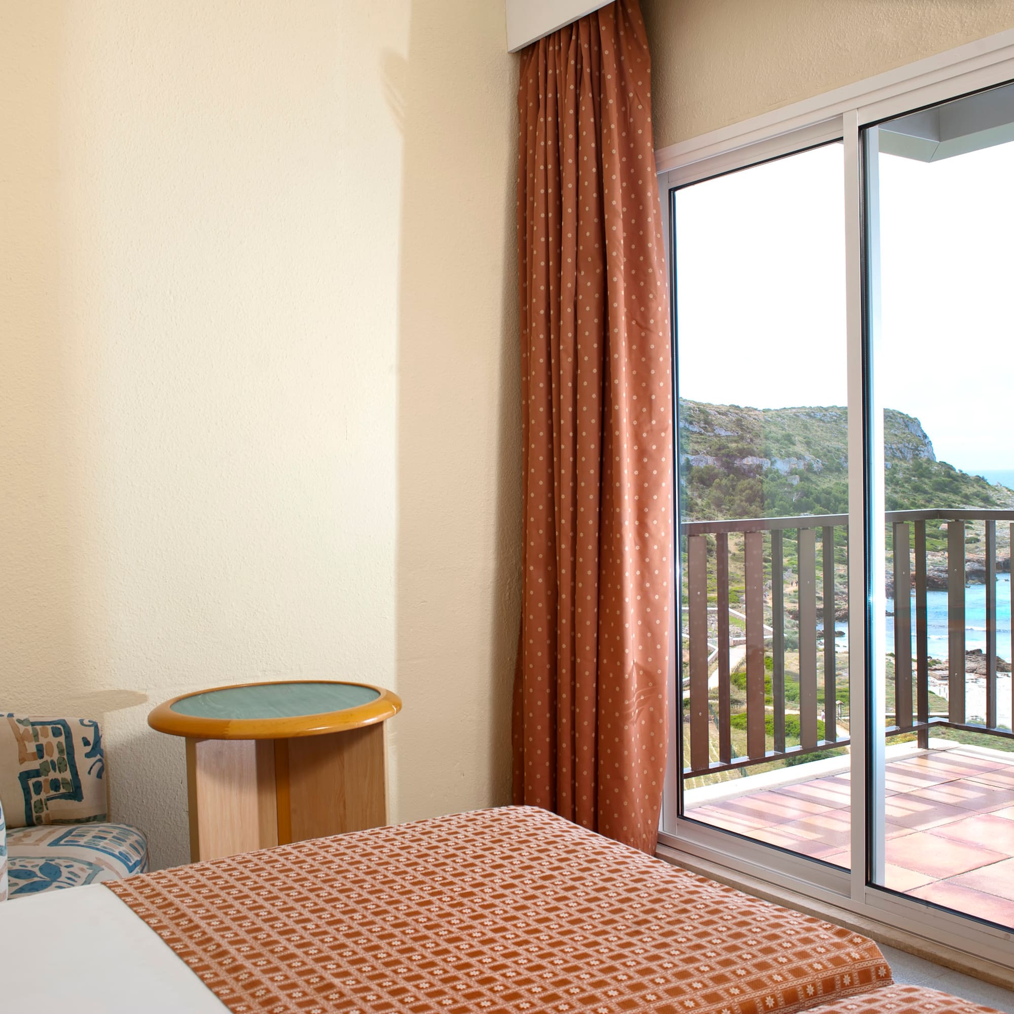 a room with a bed and a glass door