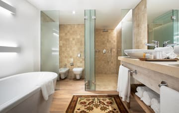 a bathroom with a bathtub and toilet