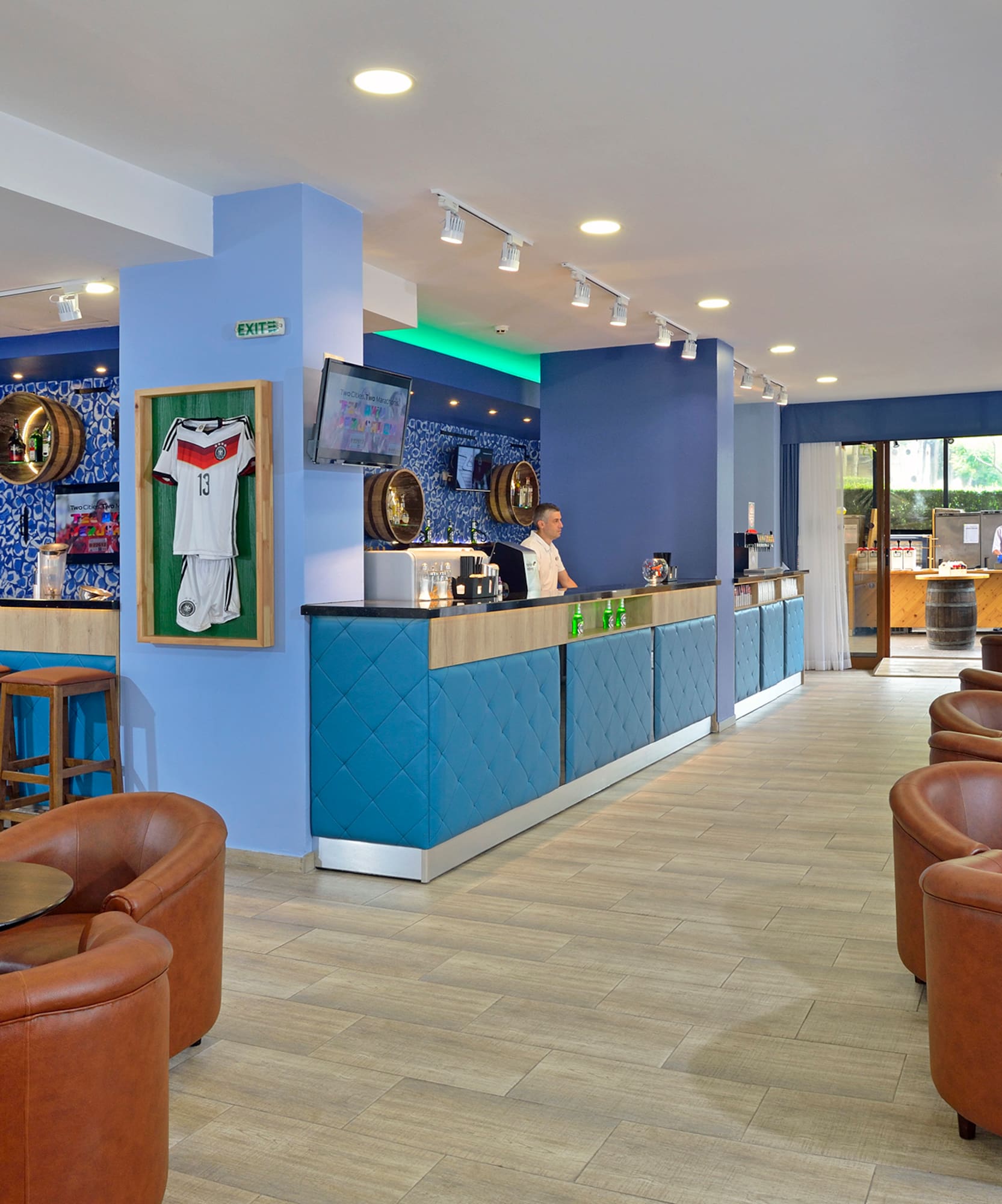 a room with blue walls and tables and chairs