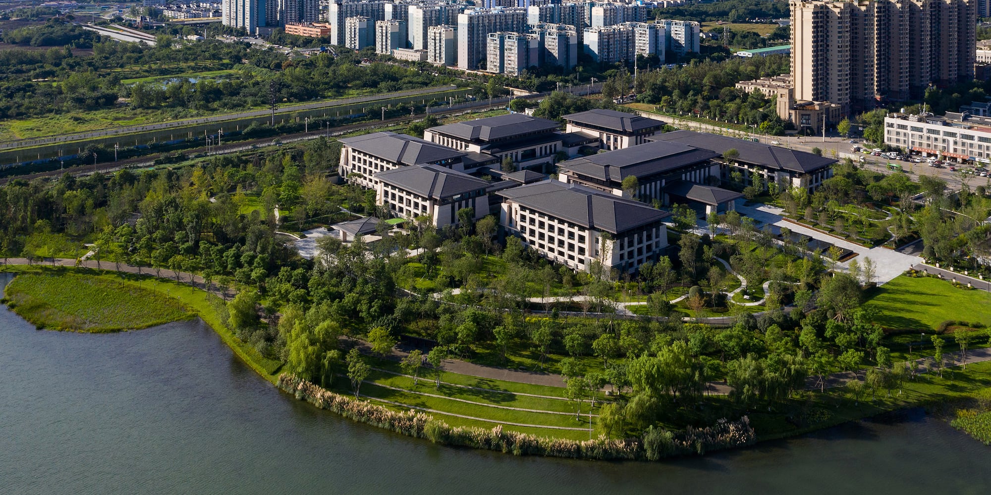 a building next to a body of water