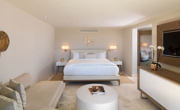a bedroom with a bed and a table