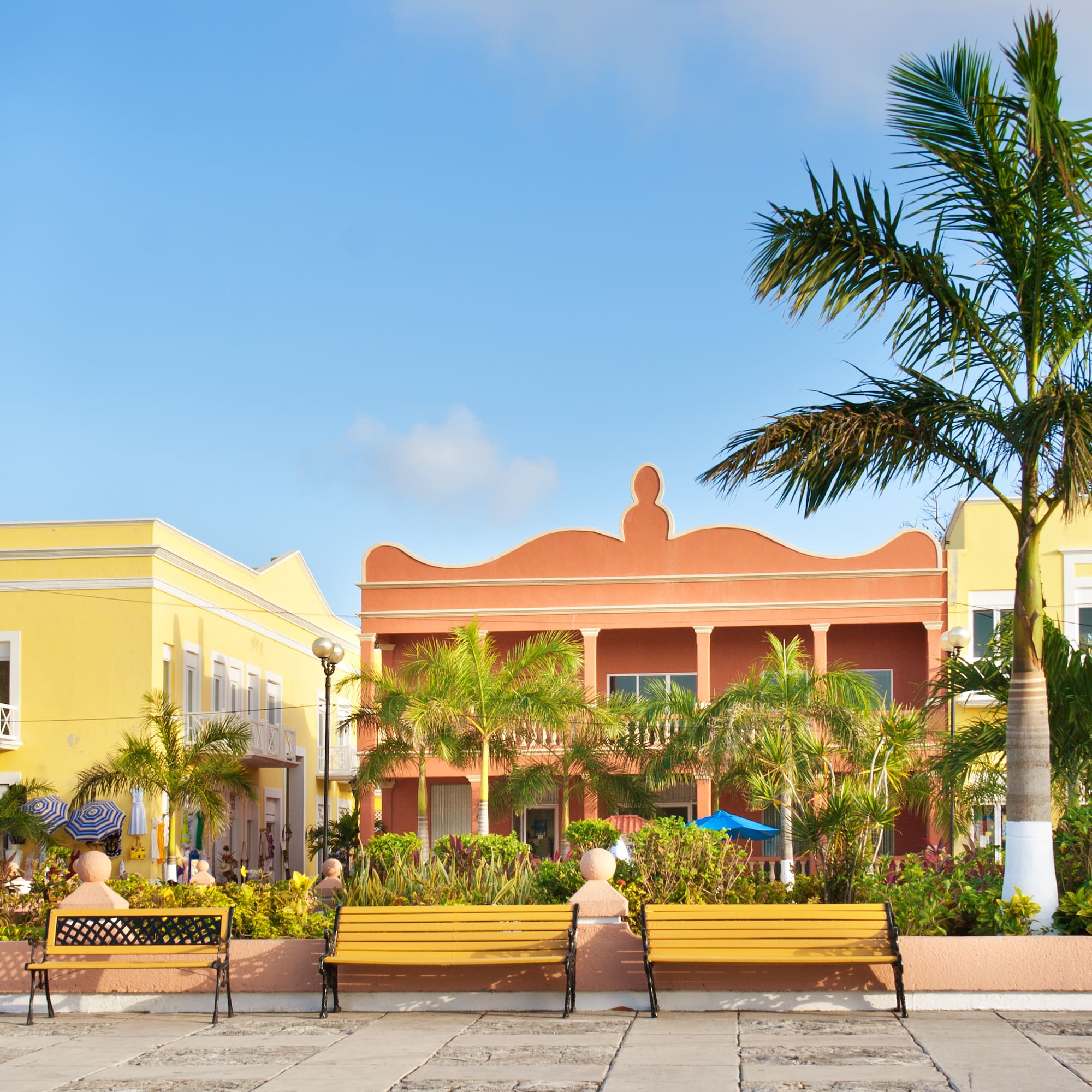 a group of benches in front of a building