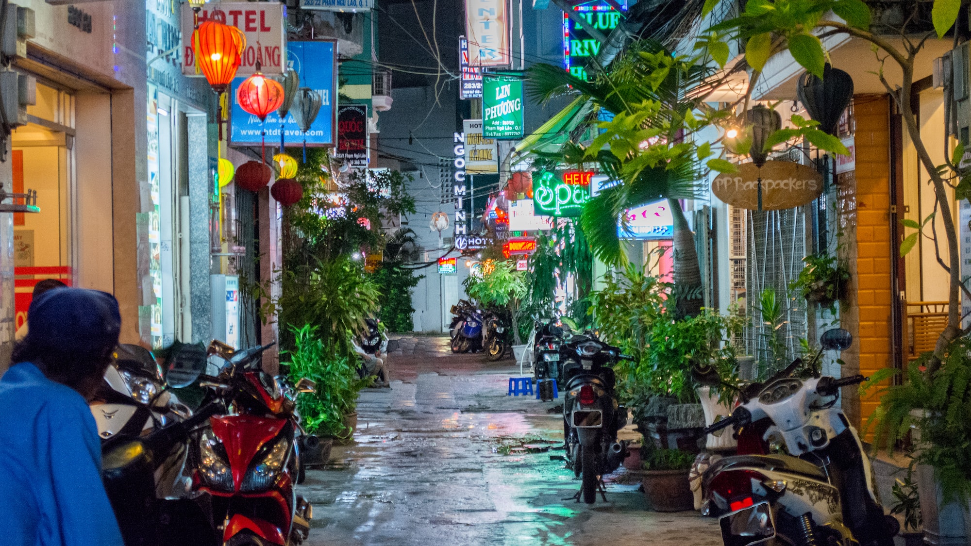 a street with motorcycles and signs