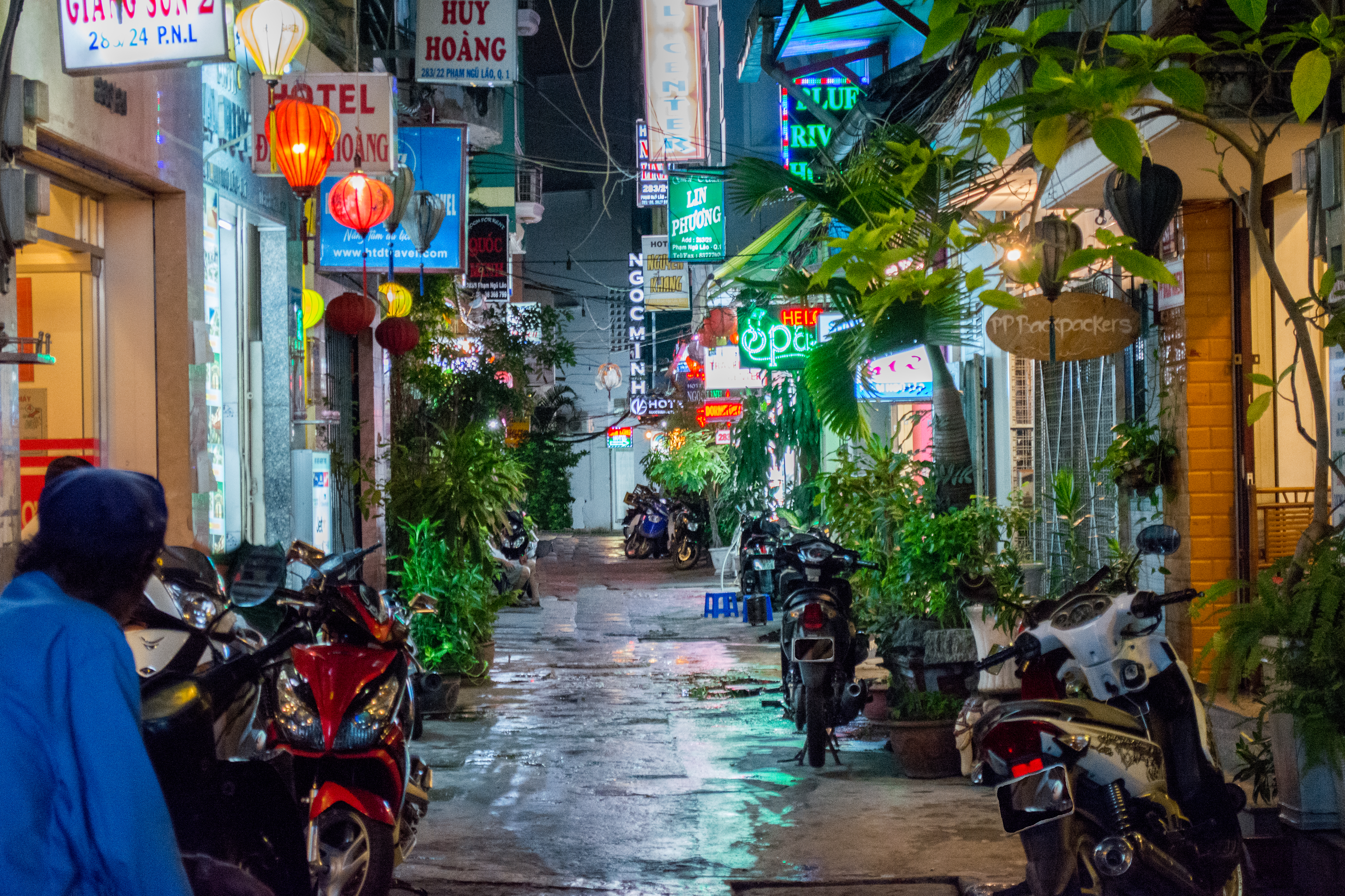 a street with motorcycles and signs