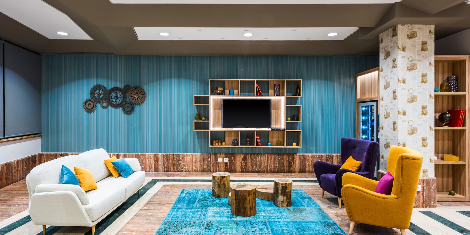 a room with a tv and couches