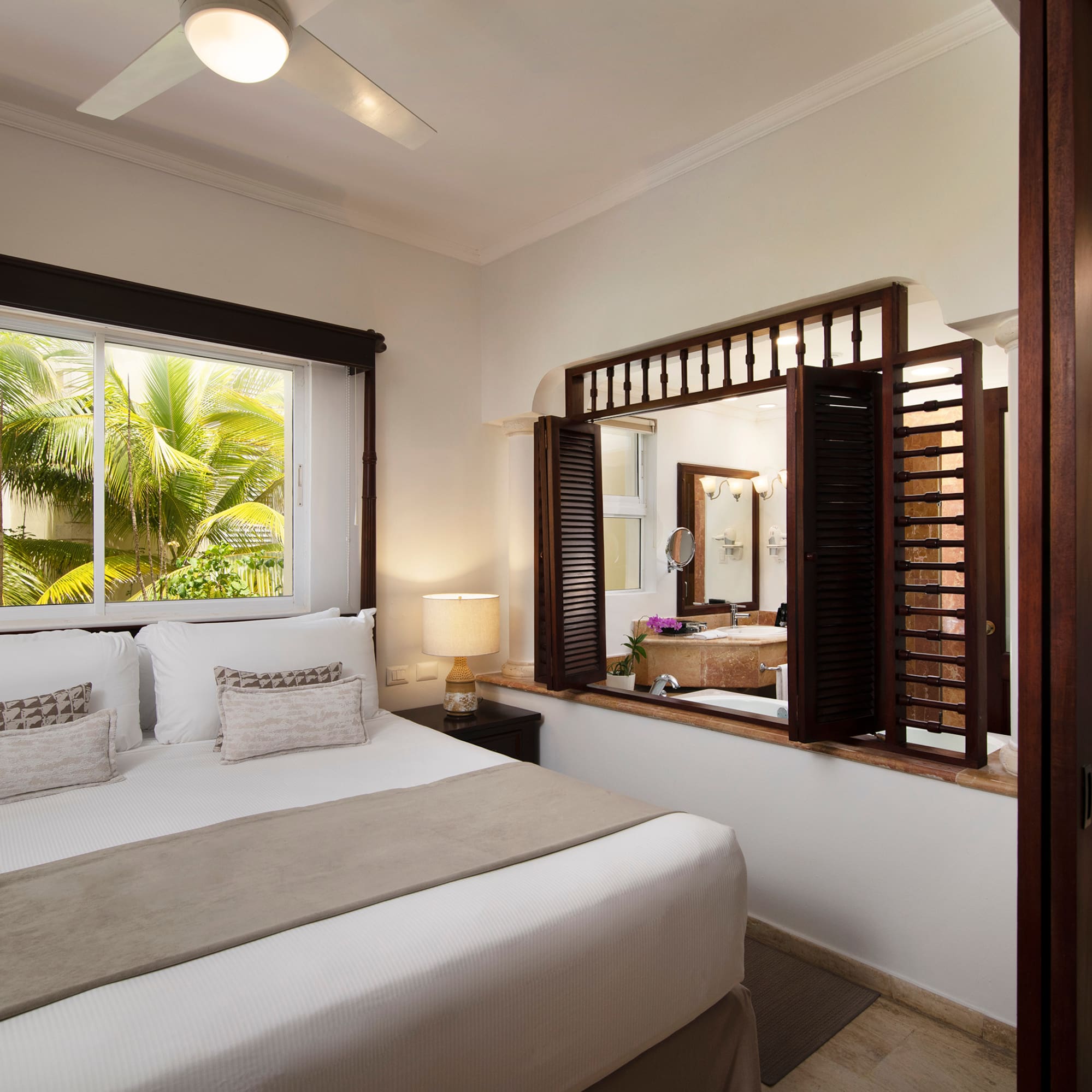 a bedroom with a window and a bed