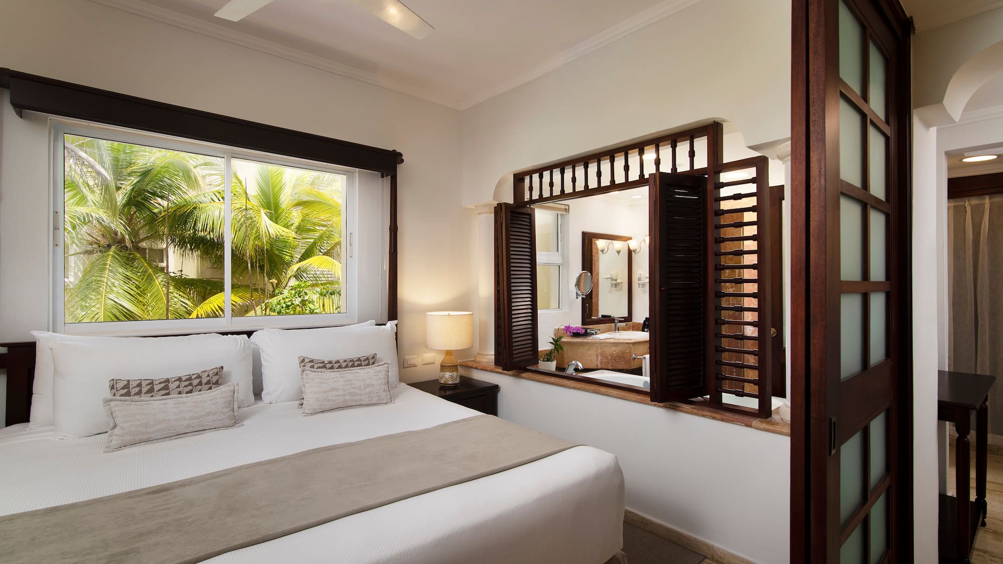 a bedroom with a window and a bed