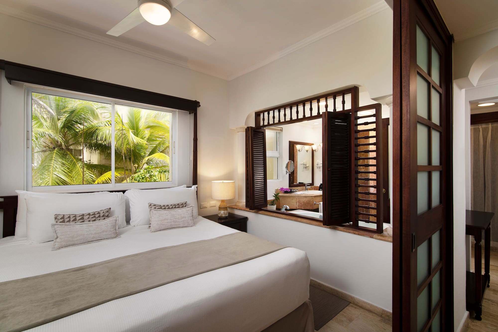 a bedroom with a window and a bed