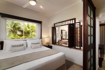 a bedroom with a window and a bed