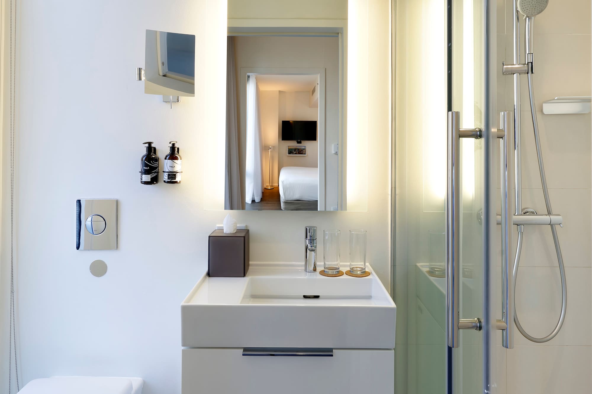 a bathroom with a shower and sink