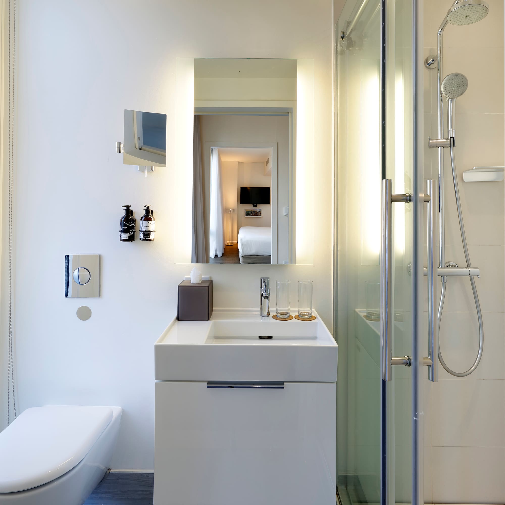 a bathroom with a shower and sink