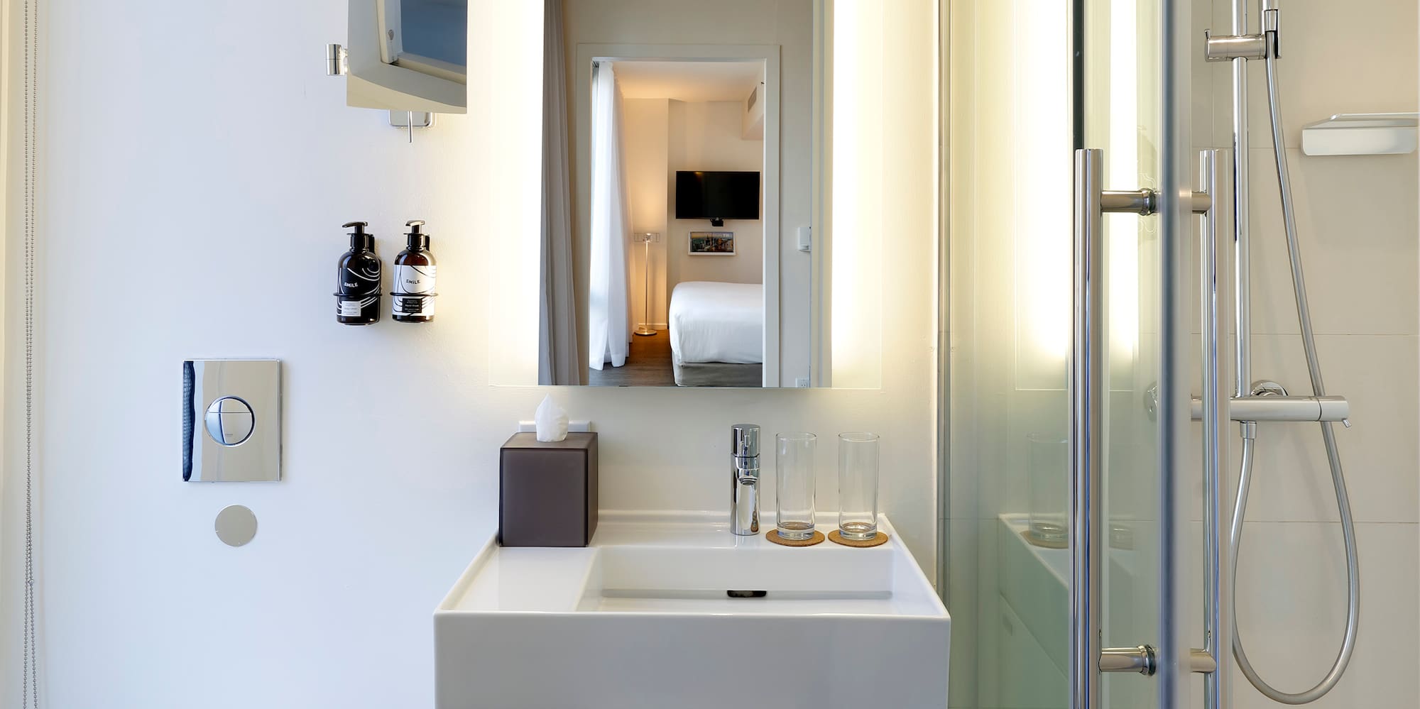 a bathroom with a shower and sink