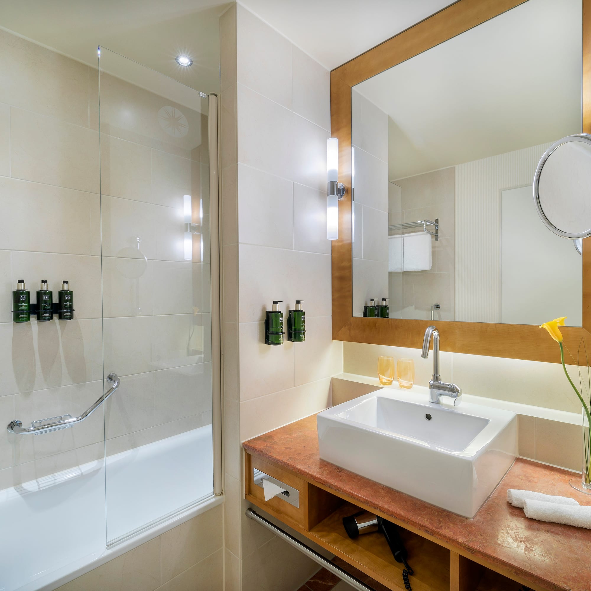 a bathroom with a sink and shower