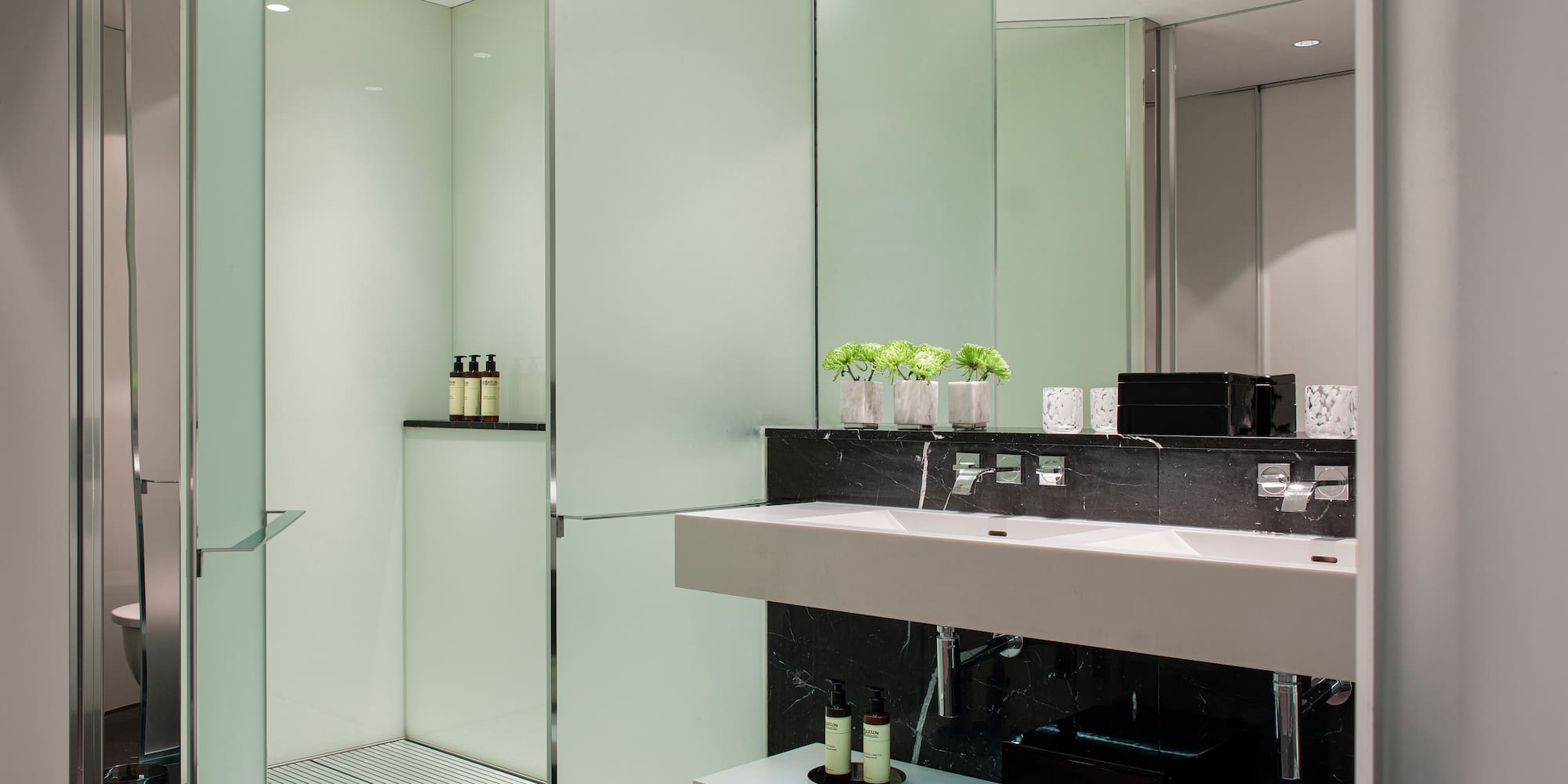 a bathroom with a shower and sink