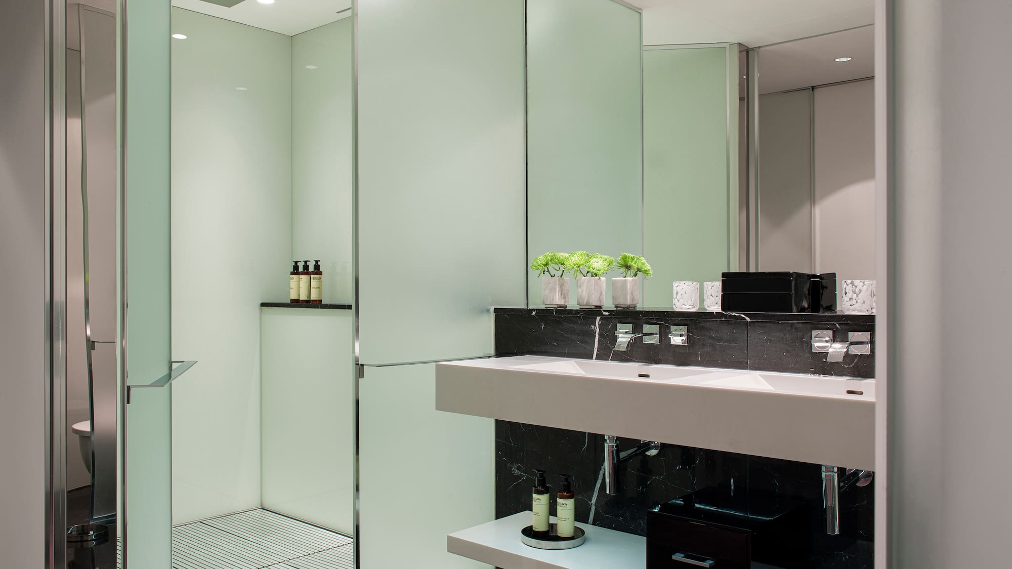 a bathroom with a shower and sink