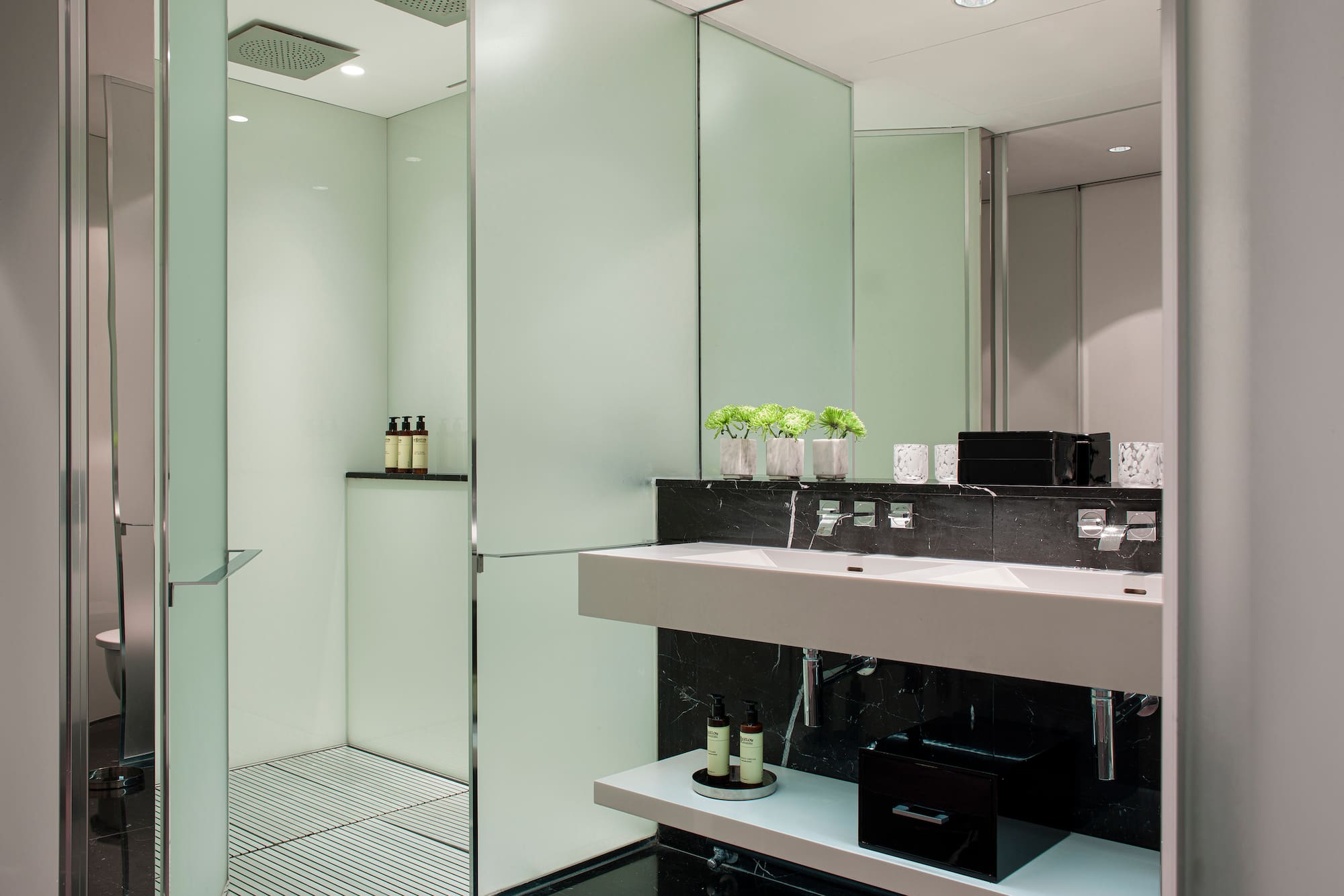 a bathroom with a shower and sink