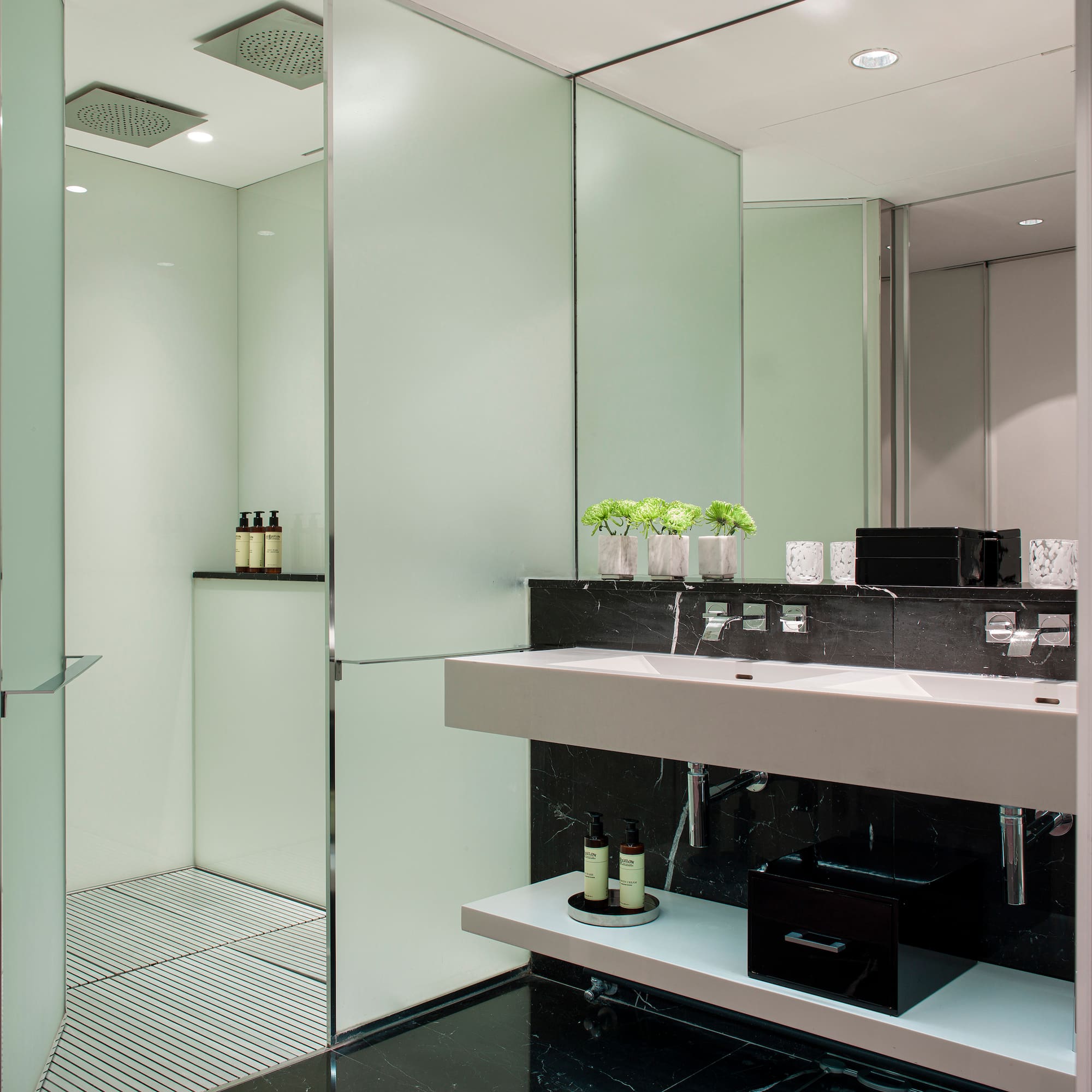 a bathroom with a shower and sink