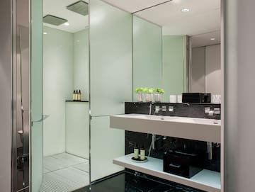 a bathroom with a shower and sink