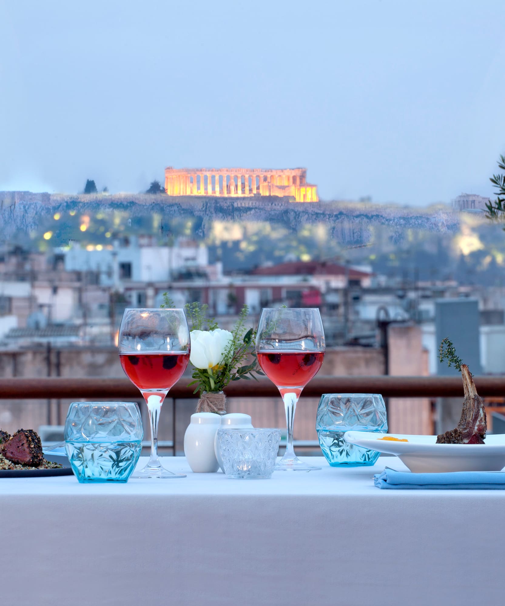 a table with wine glasses and food on it