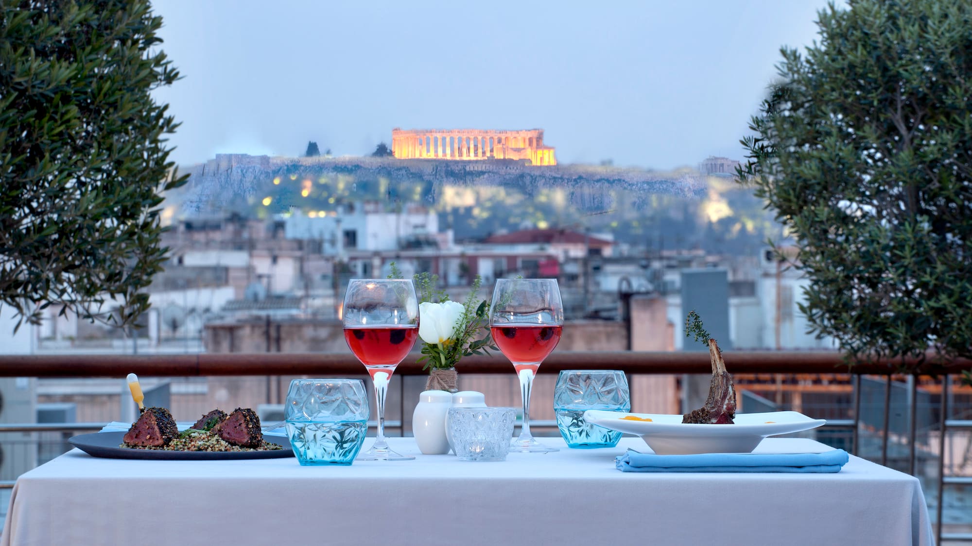 a table with wine glasses and food on it