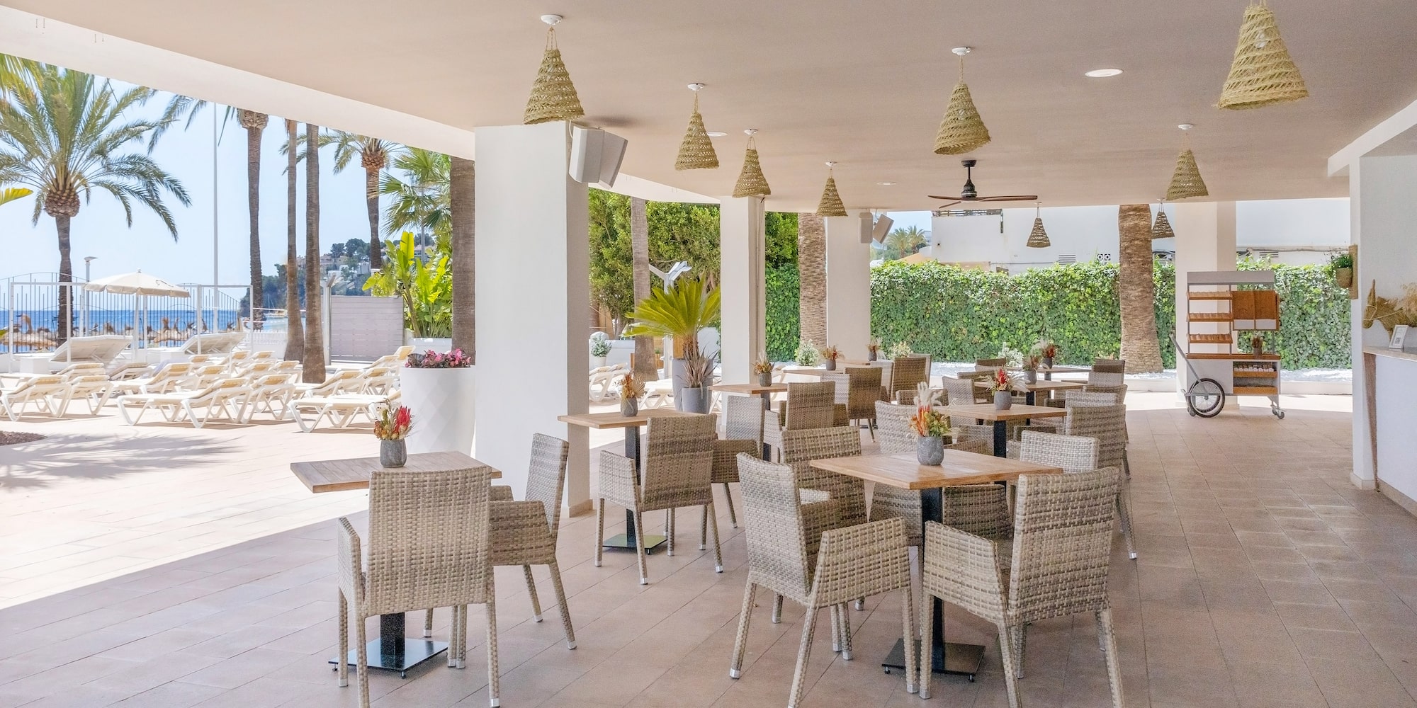 a patio with tables and chairs