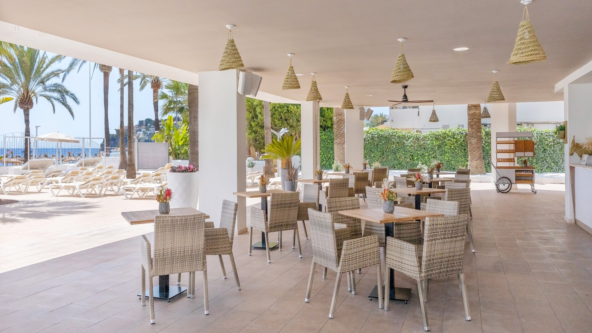a patio with tables and chairs