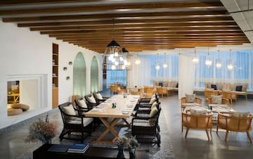 a room with a table and chairs