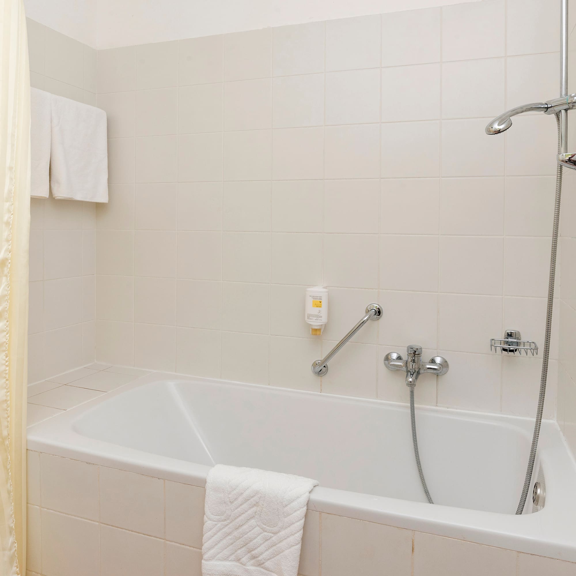 a bathtub and shower in a bathroom