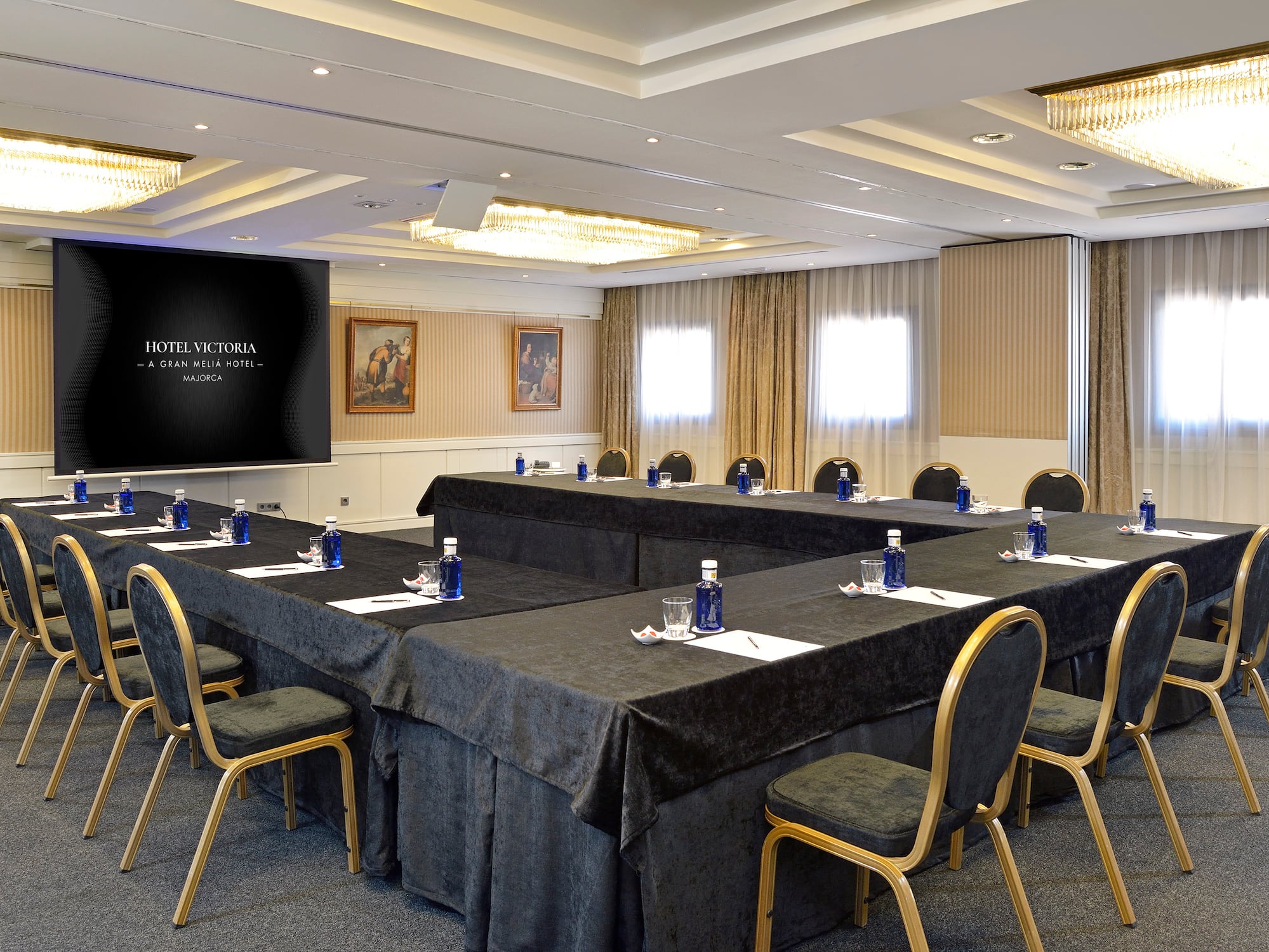 a room with a large table and chairs