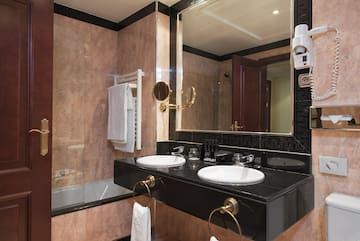 a bathroom with a mirror and sink