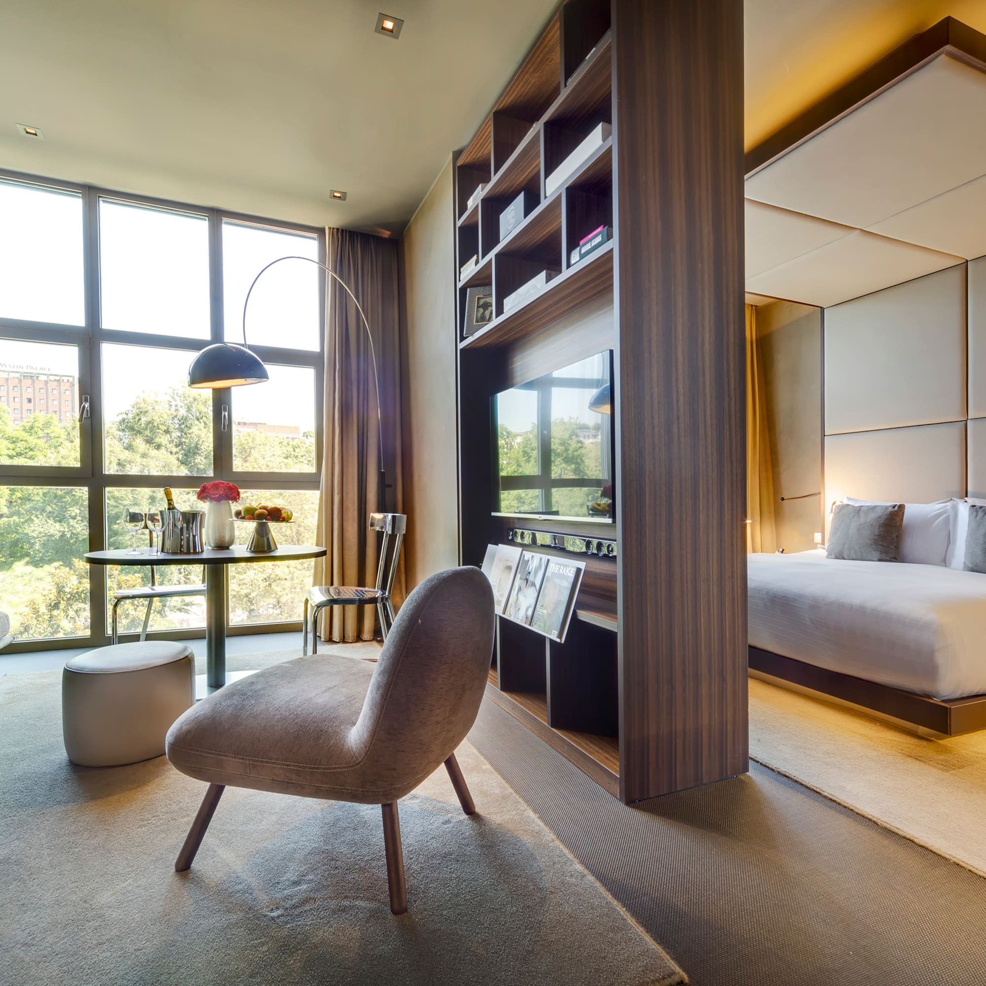 a room with a bed and a tv