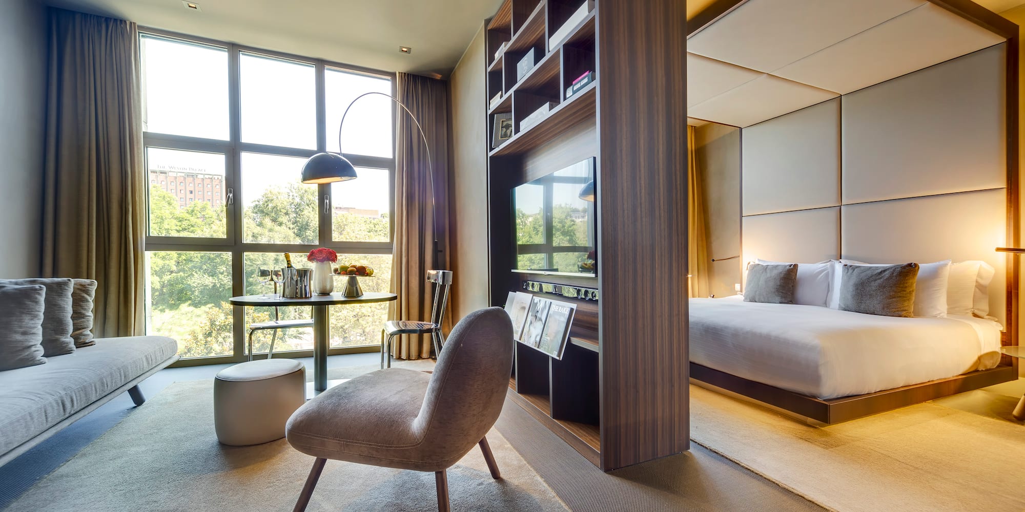 a room with a bed and a tv