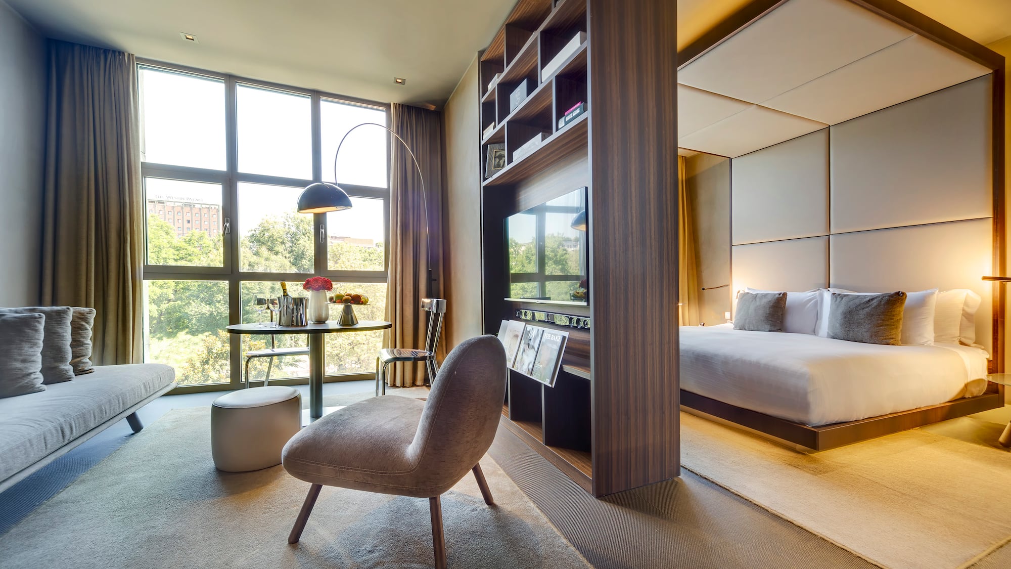 a room with a bed and a tv