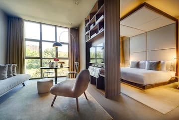 a room with a bed and a tv