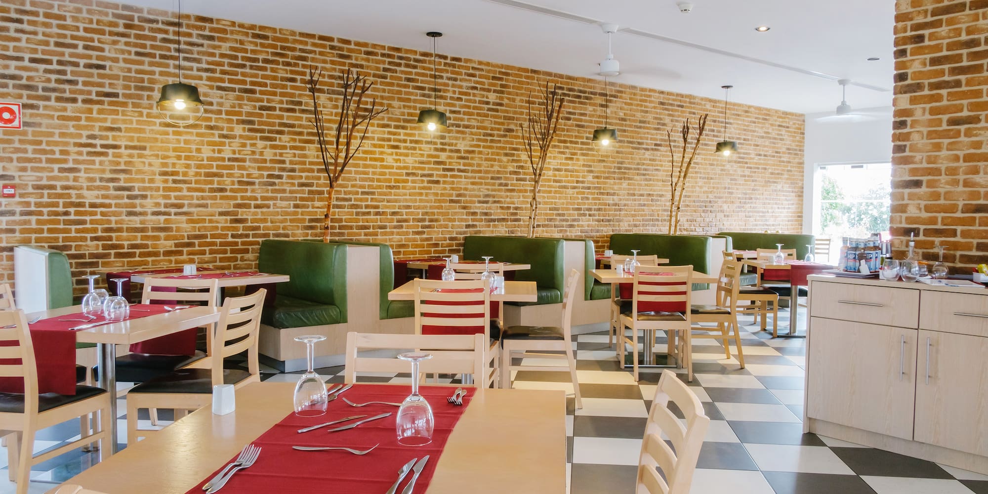 a restaurant with tables and chairs