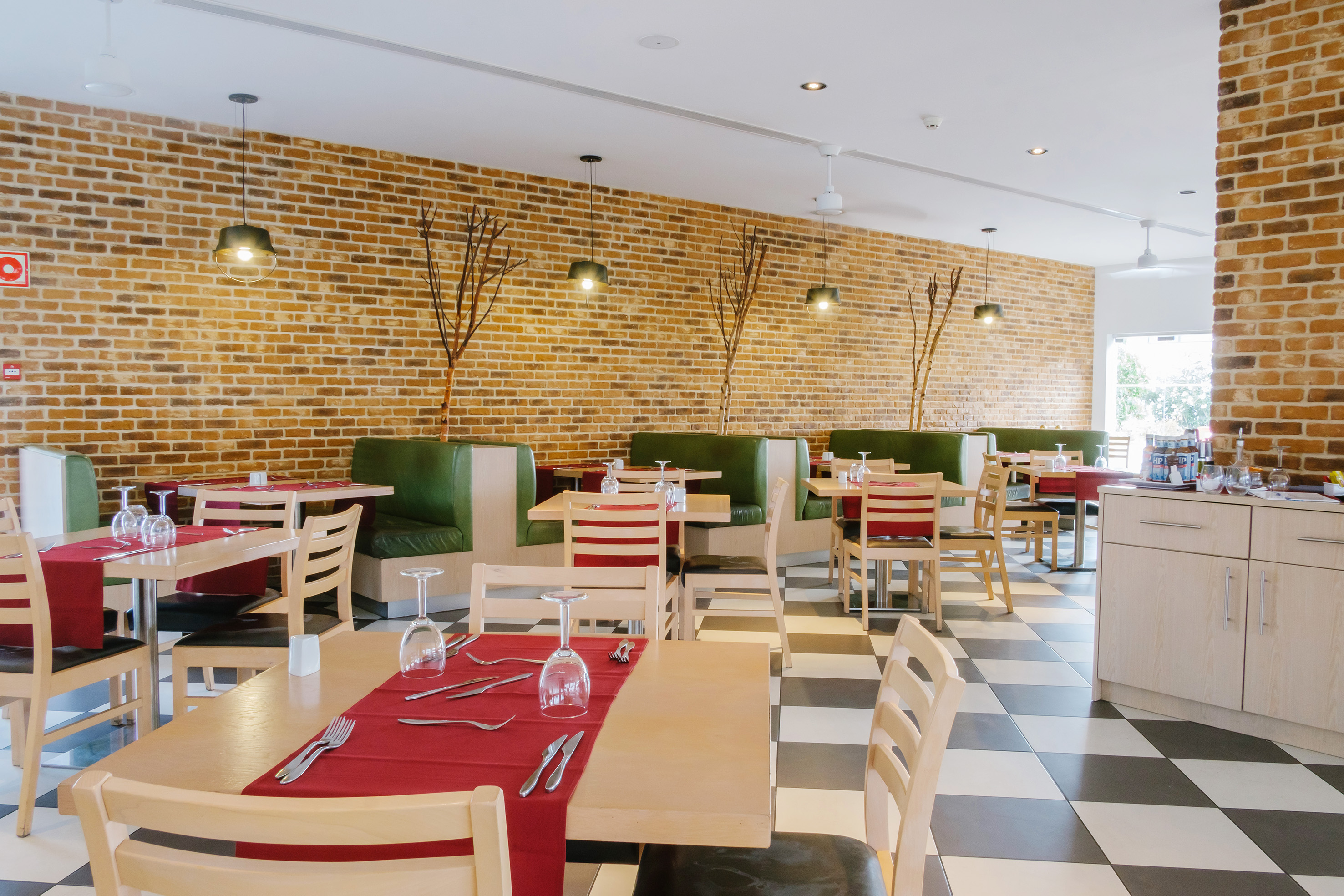 a restaurant with tables and chairs