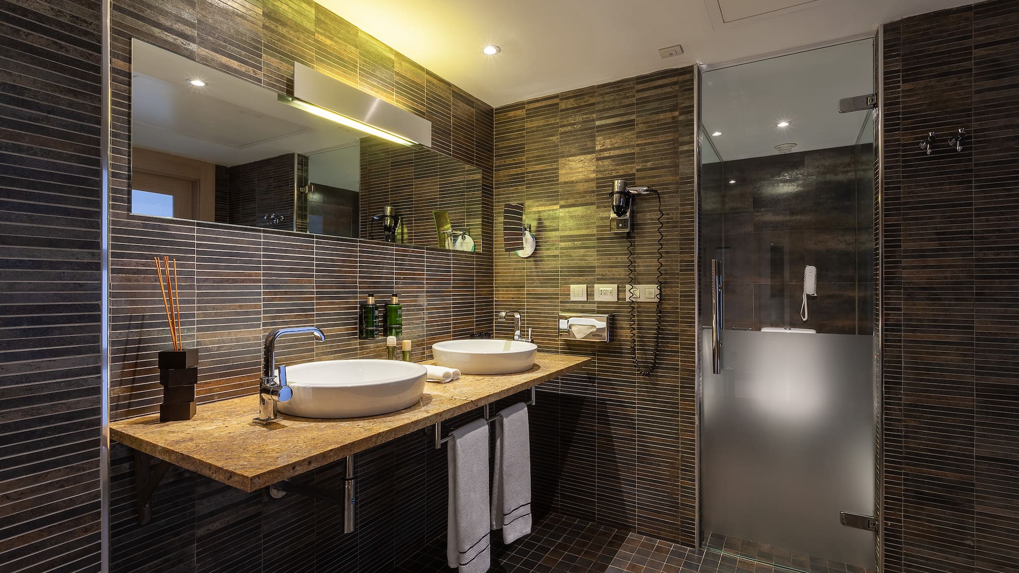 a bathroom with a shower and sink