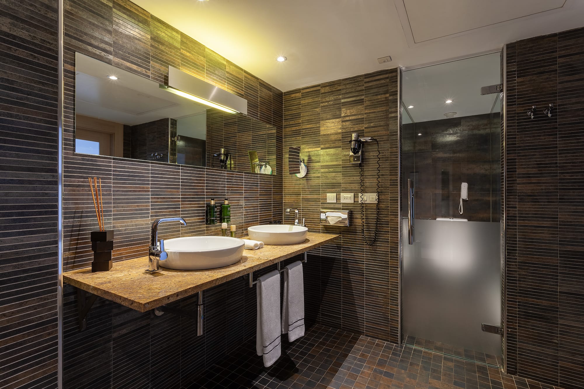 a bathroom with a shower and sink