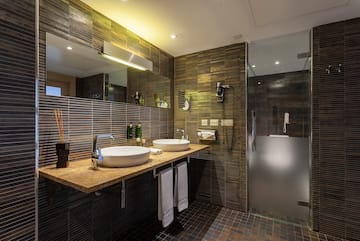 a bathroom with a shower and sink
