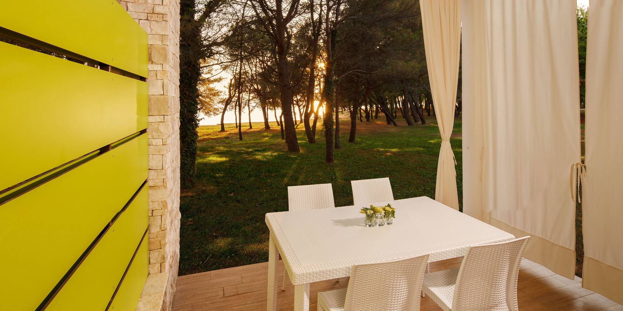 a table and chairs on a porch